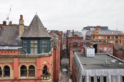 Buildings in city against sky