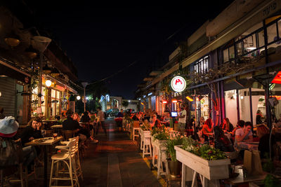 People in restaurant at night