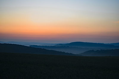 View of landscape against sky during sunset