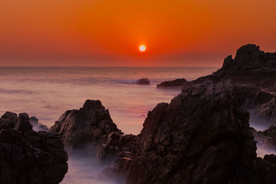 Scenic view of sea against sky during sunset