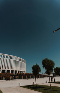 Low angle view of building against clear blue sky