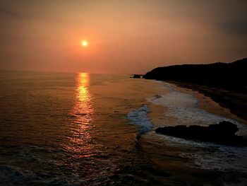 Scenic view of sea at sunset