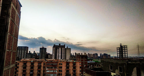 Modern buildings in city against sky