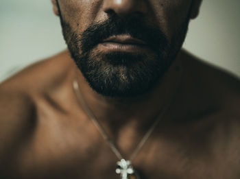 Close-up portrait of shirtless man