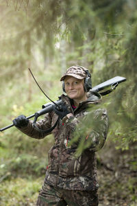 Woman hunting in forest