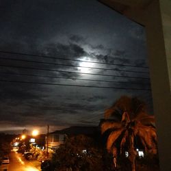 Low angle view of illuminated street at night