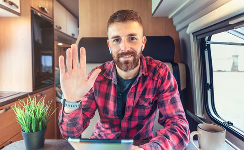 Portrait of businessman talking on video conference