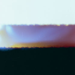 Scenic view of landscape against sky at night