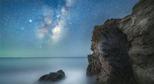 Scenic view of sea against sky at night