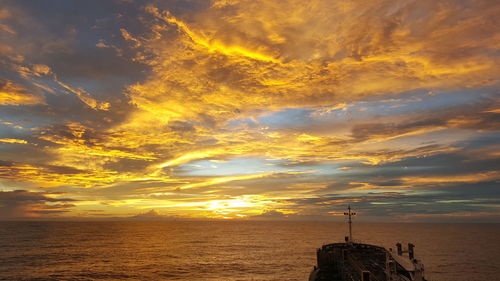 Scenic view of sea against sky at sunset