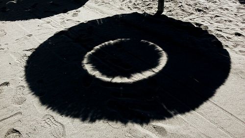 High angle view of shadow on sand