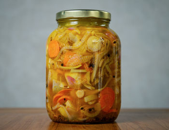 Close-up of juice in glass jar on table