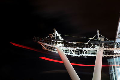 Illuminated commercial dock against sky at night