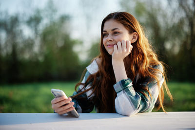 Young woman using mobile phone