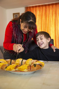 Two people having food at home