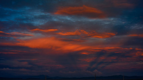 Low angle view of dramatic sky during sunset