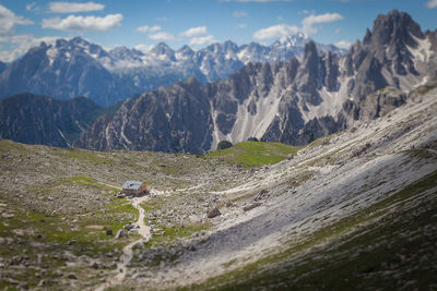 View of birds on mountain range against sky