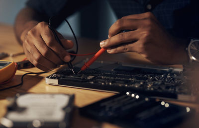 Midsection of man using laptop