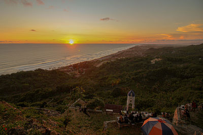 Scenic view of landscape against sky during sunset