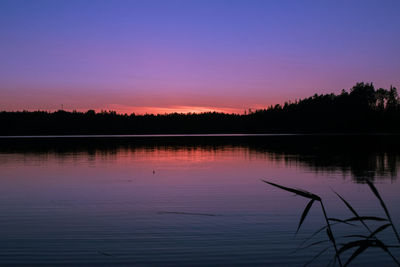 Scenic view of lake against romantic sky at sunset