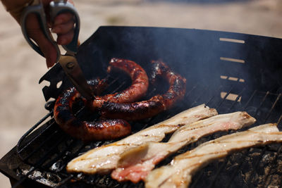 Close-up of meat on barbecue grill