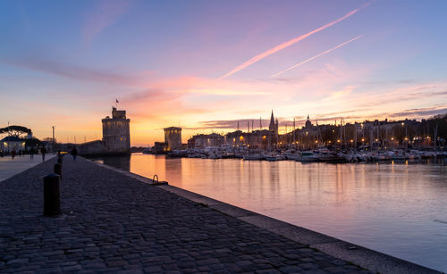 Panoramic view of the old harbor of la rochelle at blue hour with its famous old towers