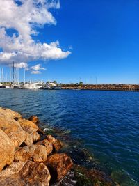 Scenic view of sea against blue sky