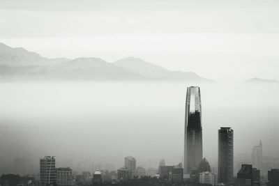 Modern buildings in city against sky