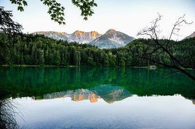 Scenic view of lake and mountains against sky