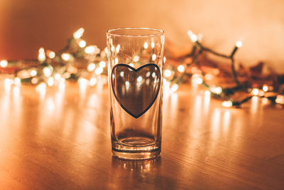 Close-up of wine in glass on table