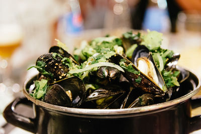 Close-up of mussels in container