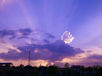 View of cityscape against cloudy sky