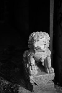 Broken lion sculpture