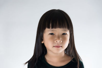 Portrait of girl against white background