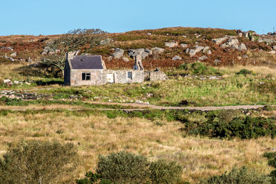 House on field against sky