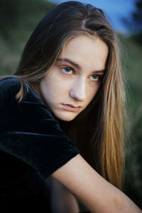 Portrait of a young beautiful woman in nature