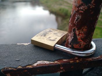 Close-up of rusty metal on wood