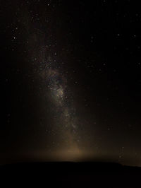 Scenic view of star field against sky at night