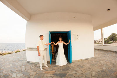 Couple standing outside building