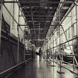 Rear view of people walking in building