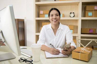 Portrait of woman sitting at table