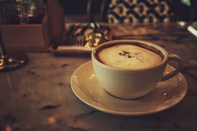 Close-up of cappuccino on table