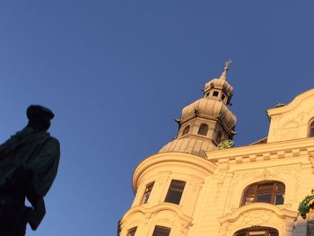 Low angle view of statue against blue sky