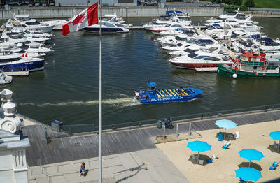 High angle view of boats moored at harbor