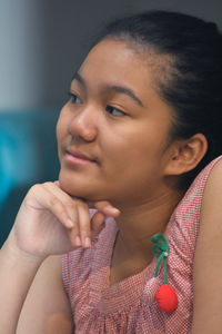 Close-up portrait of a woman looking away