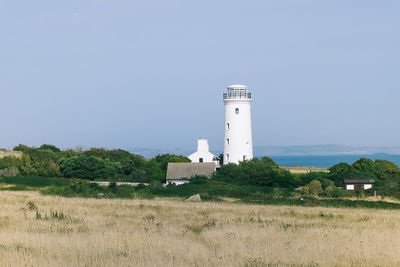 A white lighthouse on the seaside