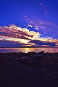 Scenic view of sea against sky at sunset