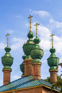 Low angle view of bell tower against sky