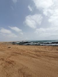 Scenic view of beach against sky