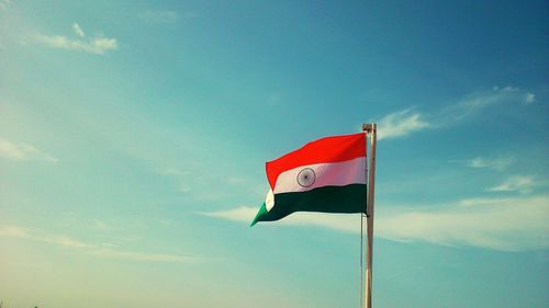 Indian flag against blue sky